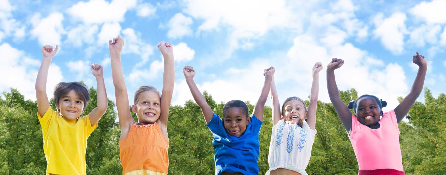 5 Children with their arms raised in the air