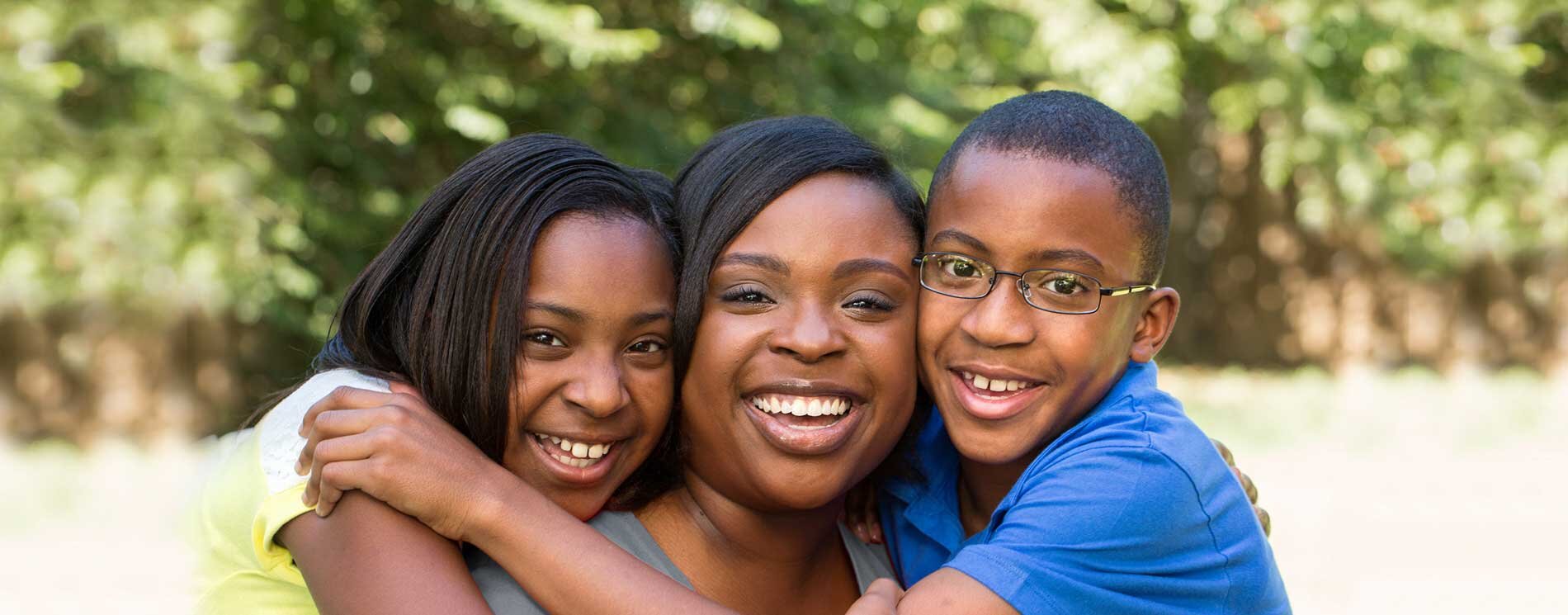 Mother and 2 children smiling