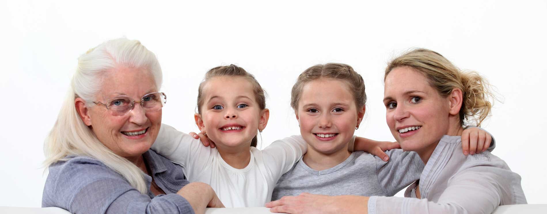 2 smiling children with mother and grandmother
